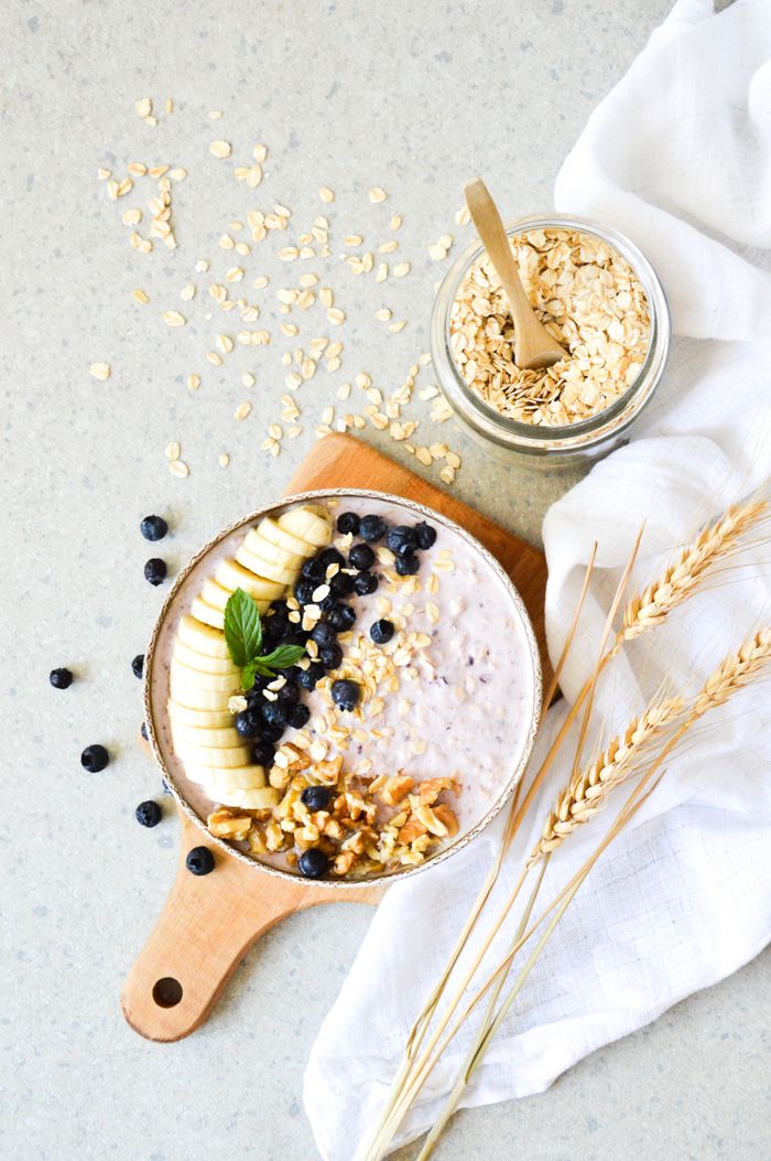 Breakfast bowl with oats, banana, blueberries, and walnuts